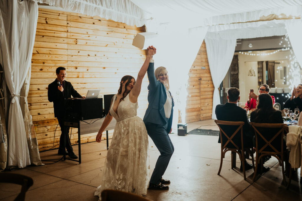 Couple Posing after their grand entrance to their reception at Boulder Creek by Wedgewood Weddings