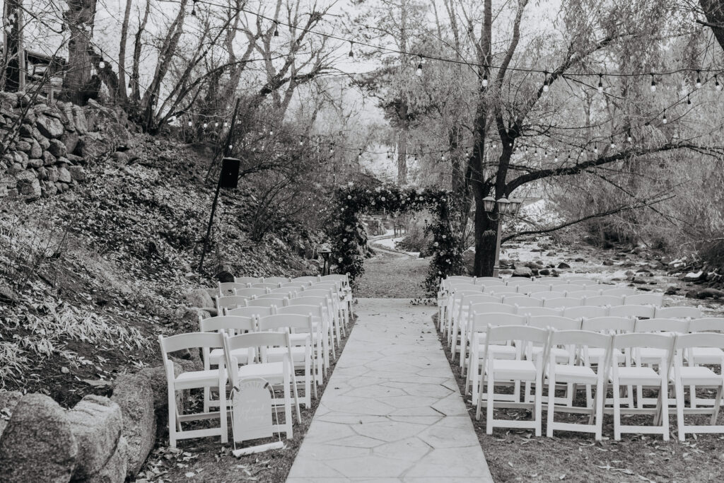 Black and White Image of Empty ceremony site with chair setup at Boulder Creek by Wedgewood Weddings up close